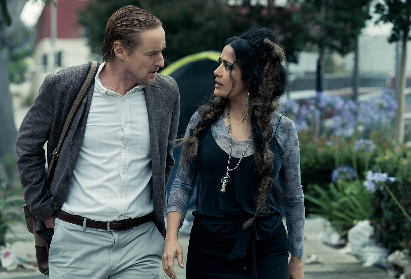 Owen Wilson as Greg Wittle and Salma Hayek as Isabel Clemens